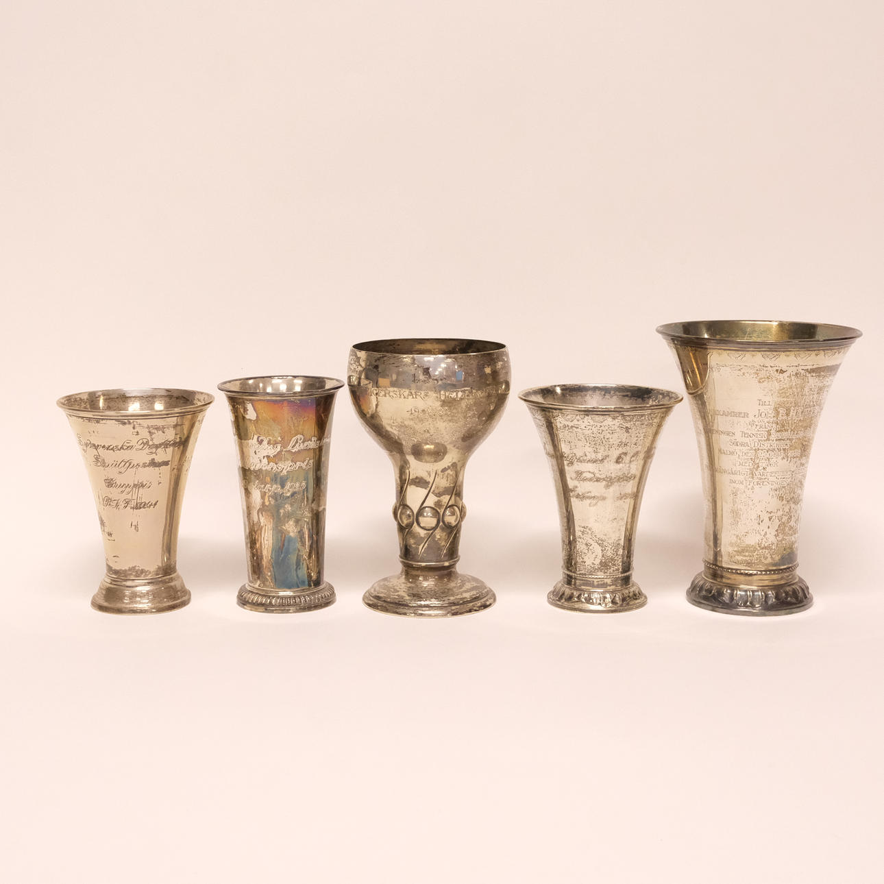 TROPHIES, SILVER, FIVE PIECES.