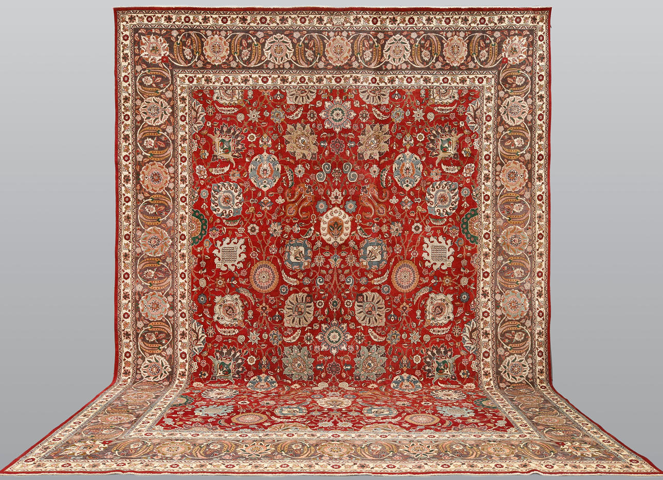 CARPET. Täbriz patinated, signed “Jevan”, 485 x 343 cm.