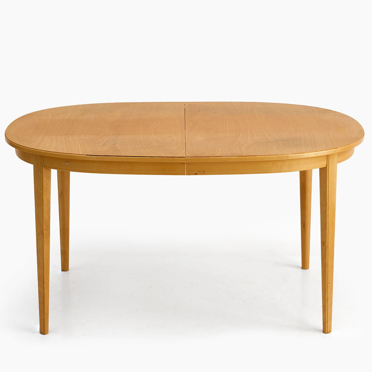 A BIRCH DINING TABLE, second half of the 20th century, with 2 inserts.
