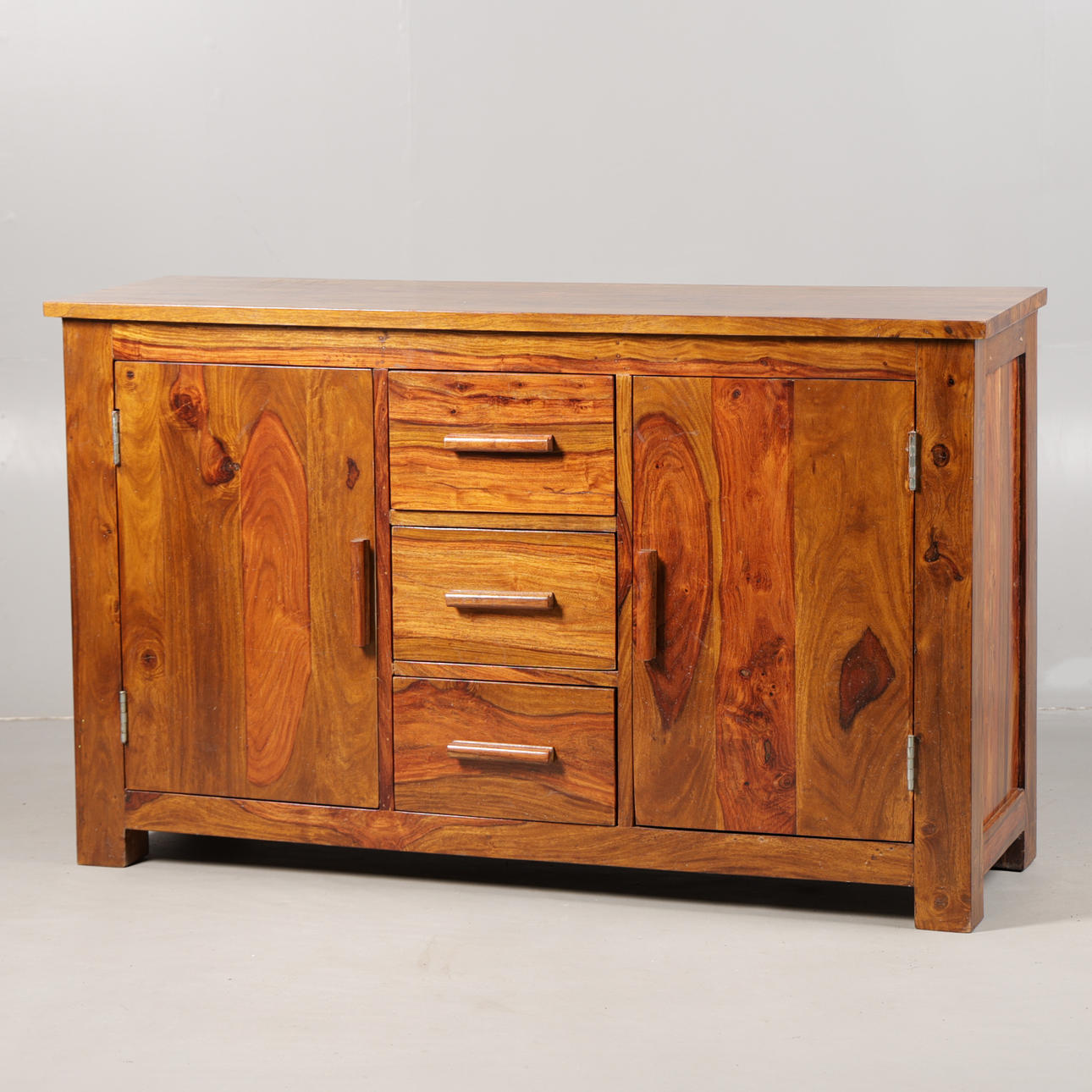 A CONTINENTAL HARDWOOD SIDEBOARD.