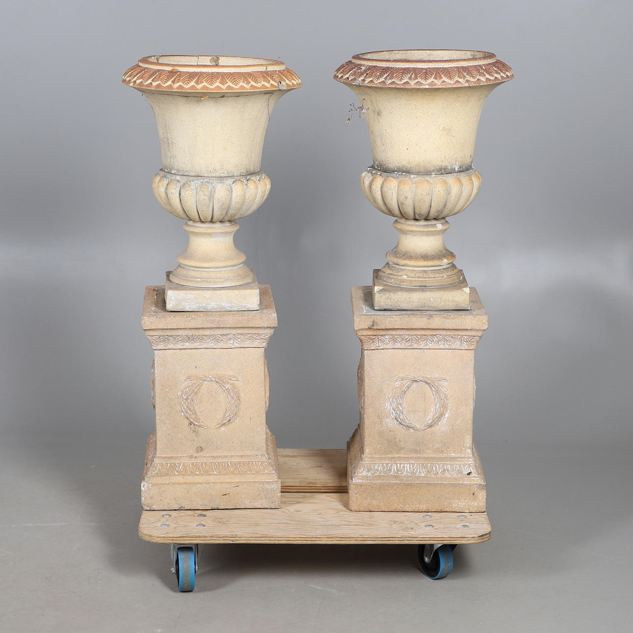 PAIR OF COMPOSITE URN PLANTERS.