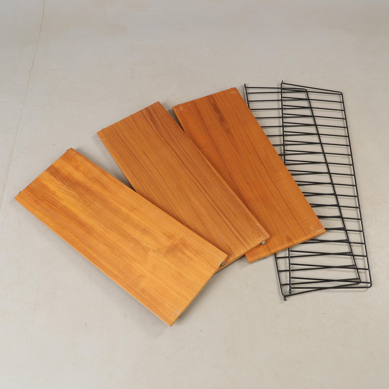 NILS STRINNING. A teak shelf, String Design AB, mid 20th century.