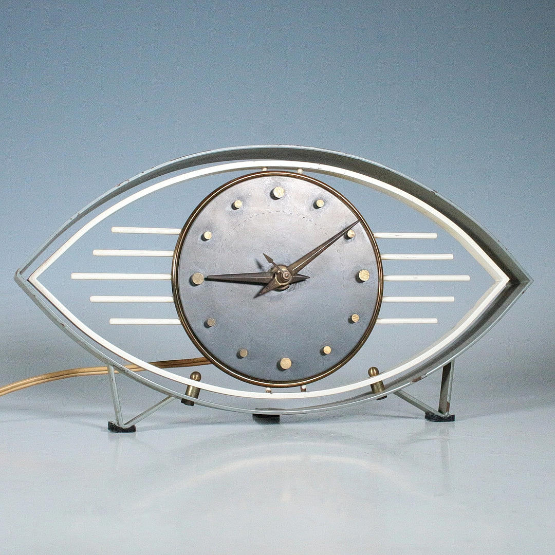 Mid-century British Metamec “Atomic Eye” table clock.
