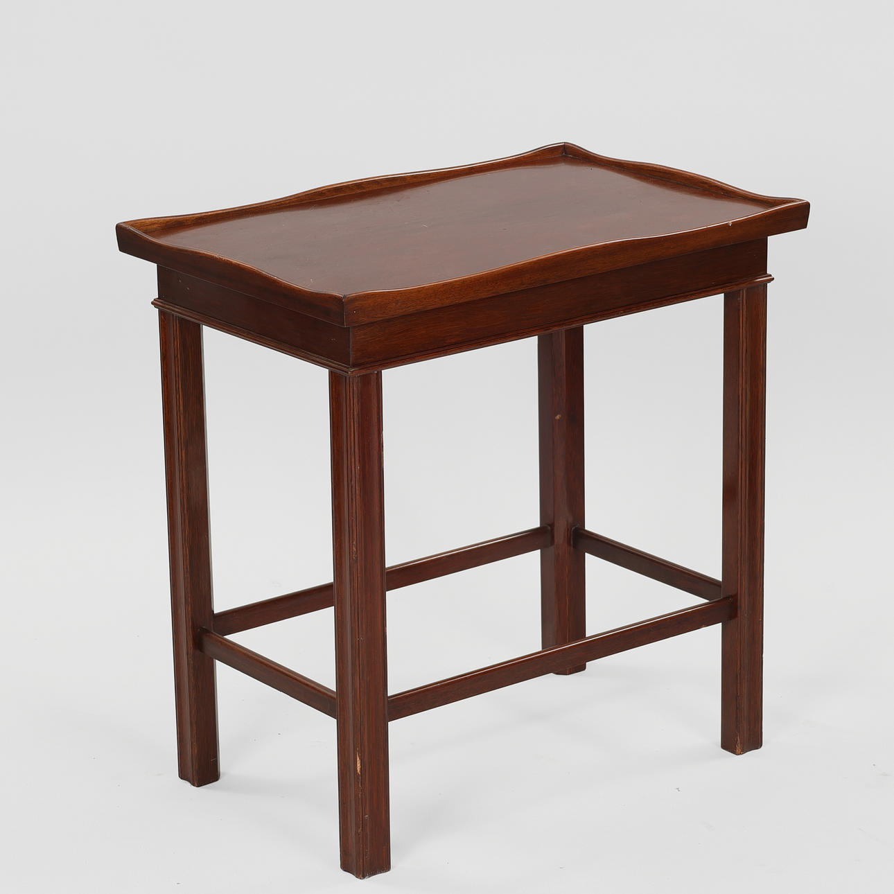 M. ANDREASEN'S MØBELFABRIK. Mahogany side table with profiled frame and undulating edge, Denmark, circa 1950s.