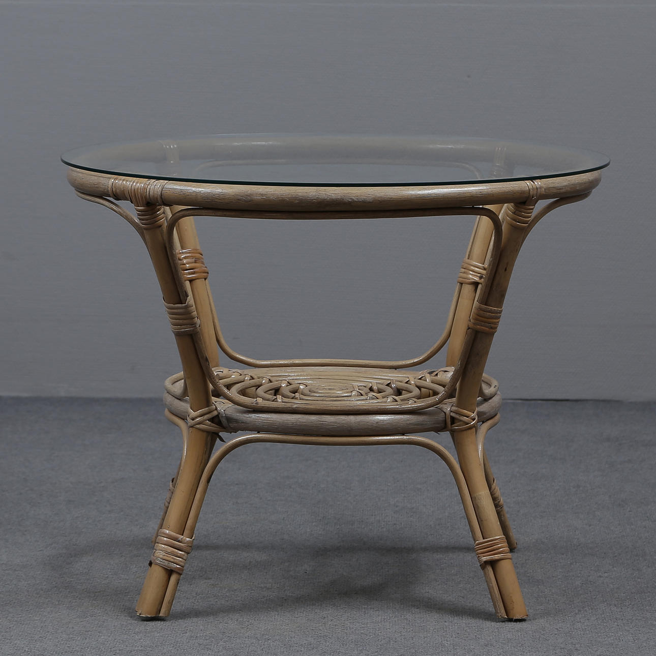 RATTAN TABLE WITH GLASS TOP.