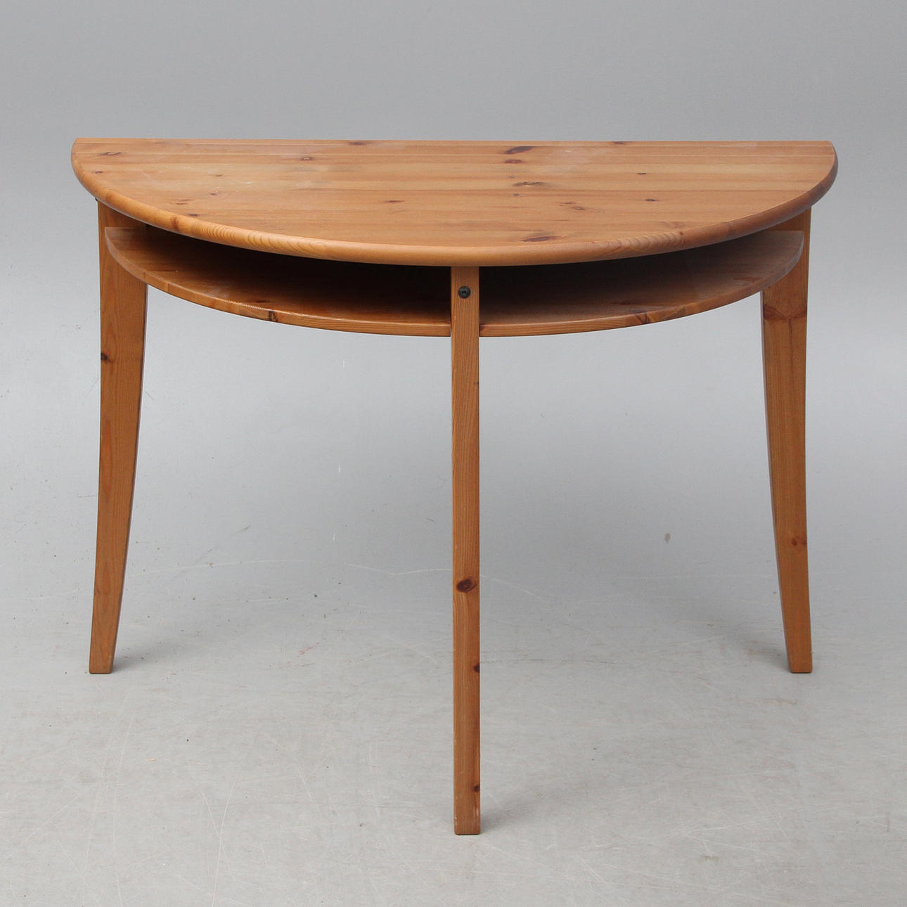 A 20th century half-moon table.