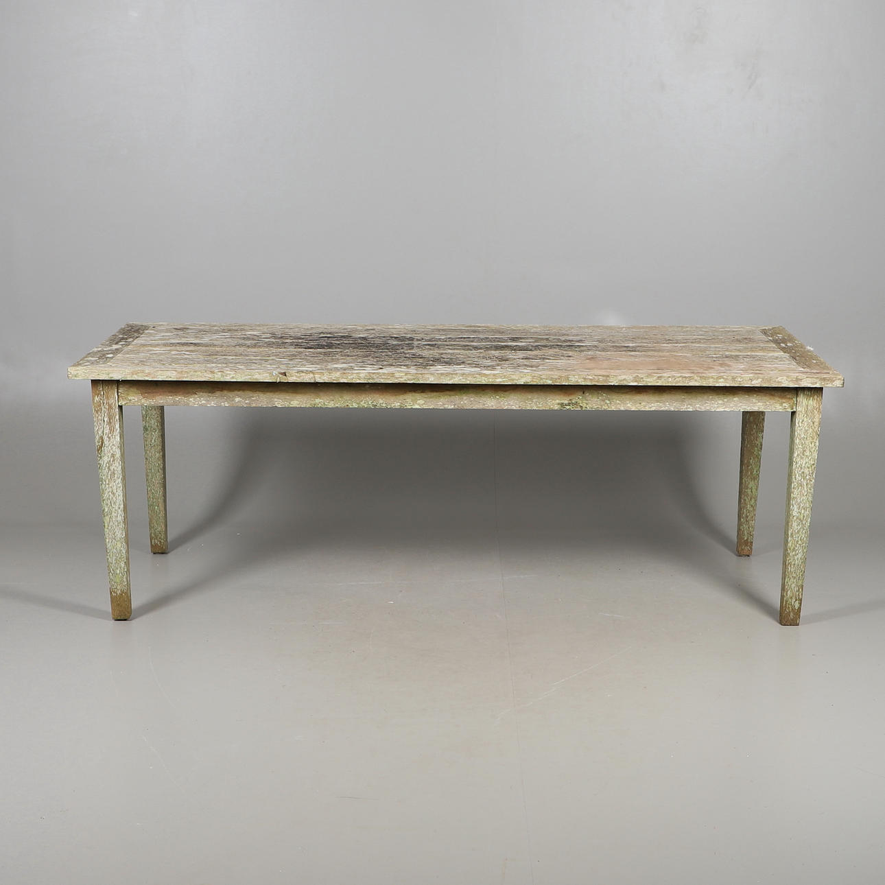 A TEAK GARDEN TABLE.