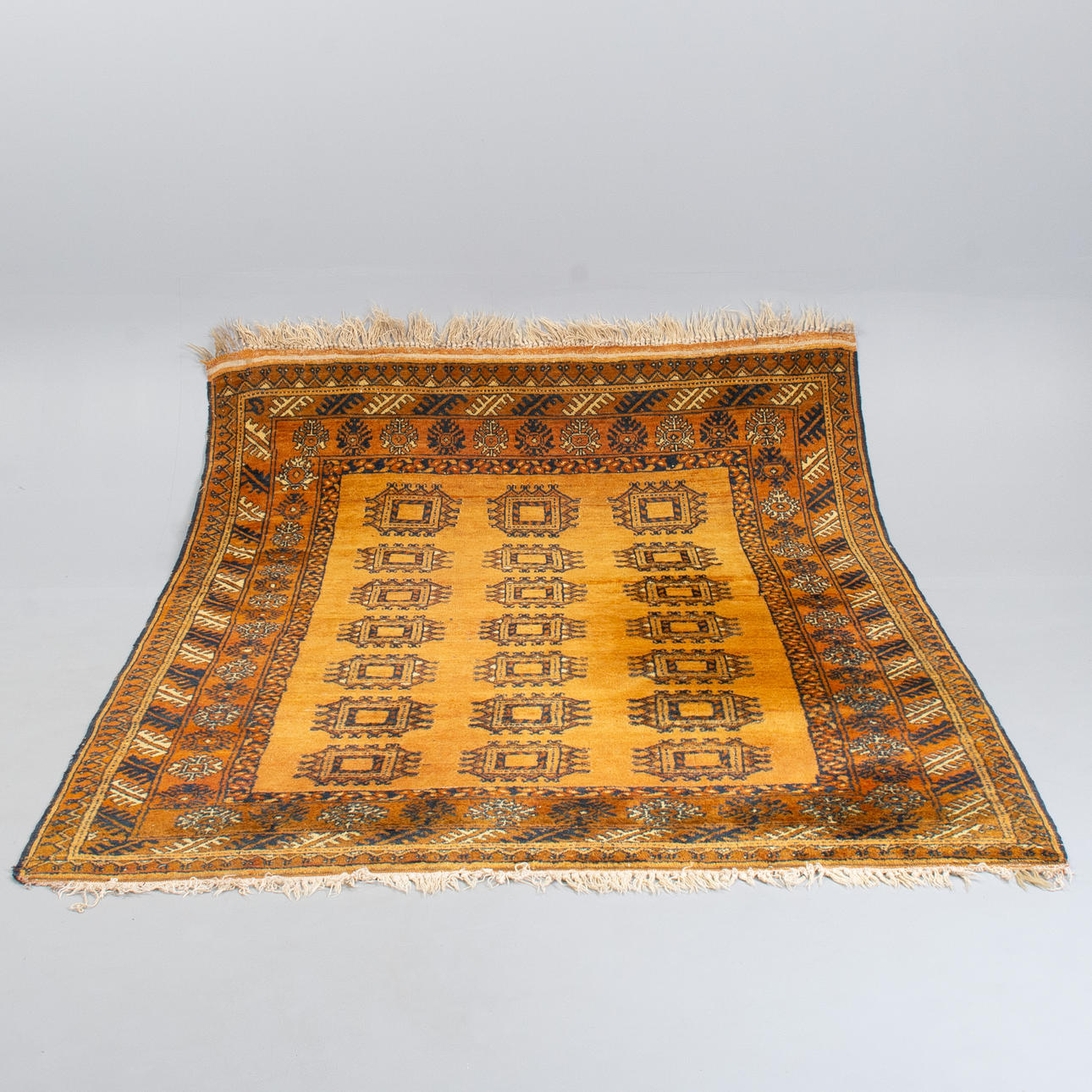 BUKHARA CARPET. Golden brown wool.