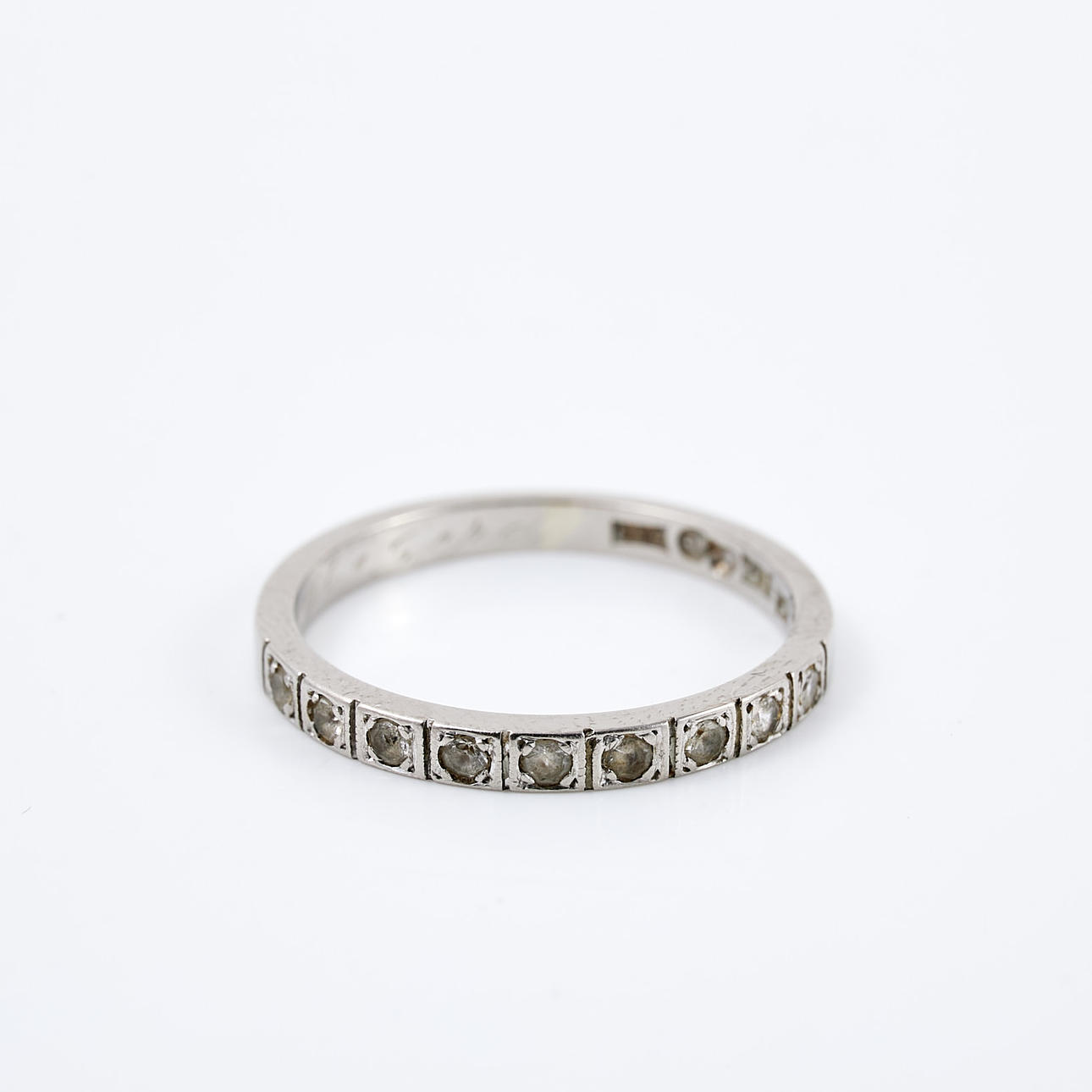 RING. Half-alliance ring, 18k white gold, octagonal cut white sapphires, Trege Guldsmedsaktiebolaget, Gothenburg, 1957.