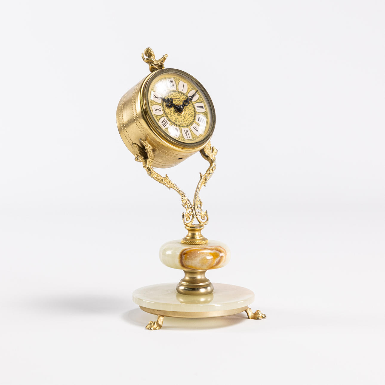 A table clock, onyx and yellow metal, Germany.