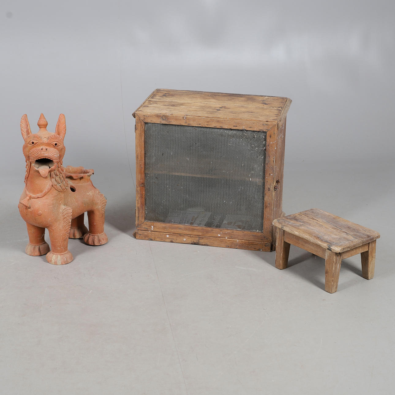 A TERRACOTTA DRAGON PLANTER AND OTHERS.