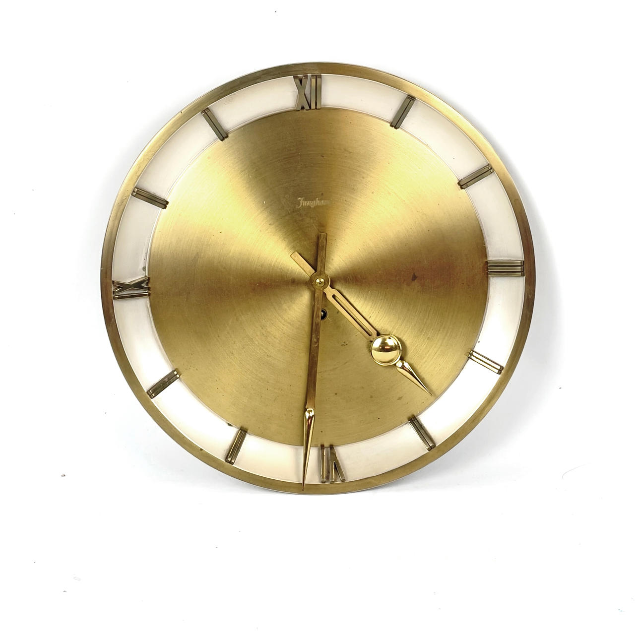 A metal wall clock from Junghans, Germany.
