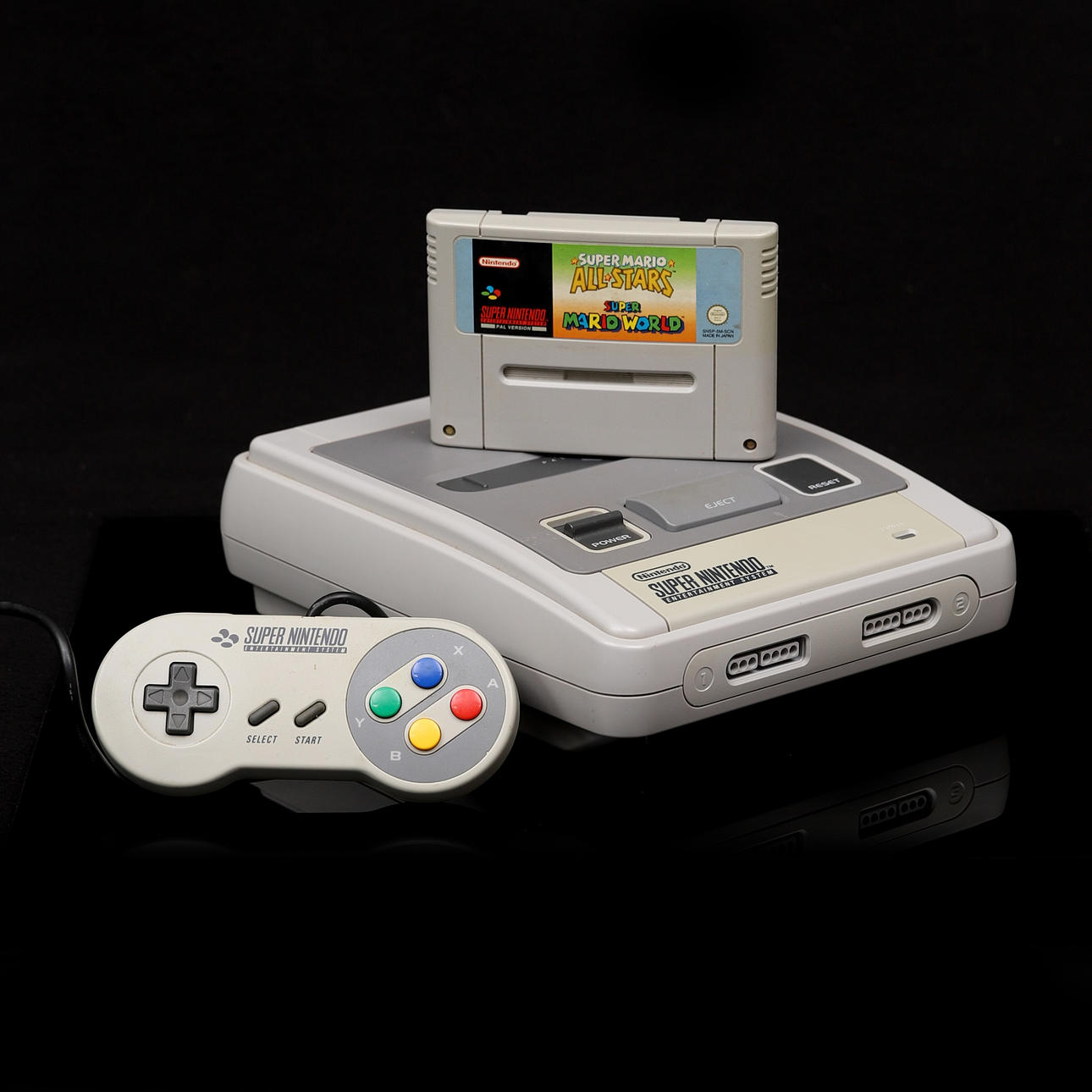 A game console, Super Nintendo Entertainment System, 90s.