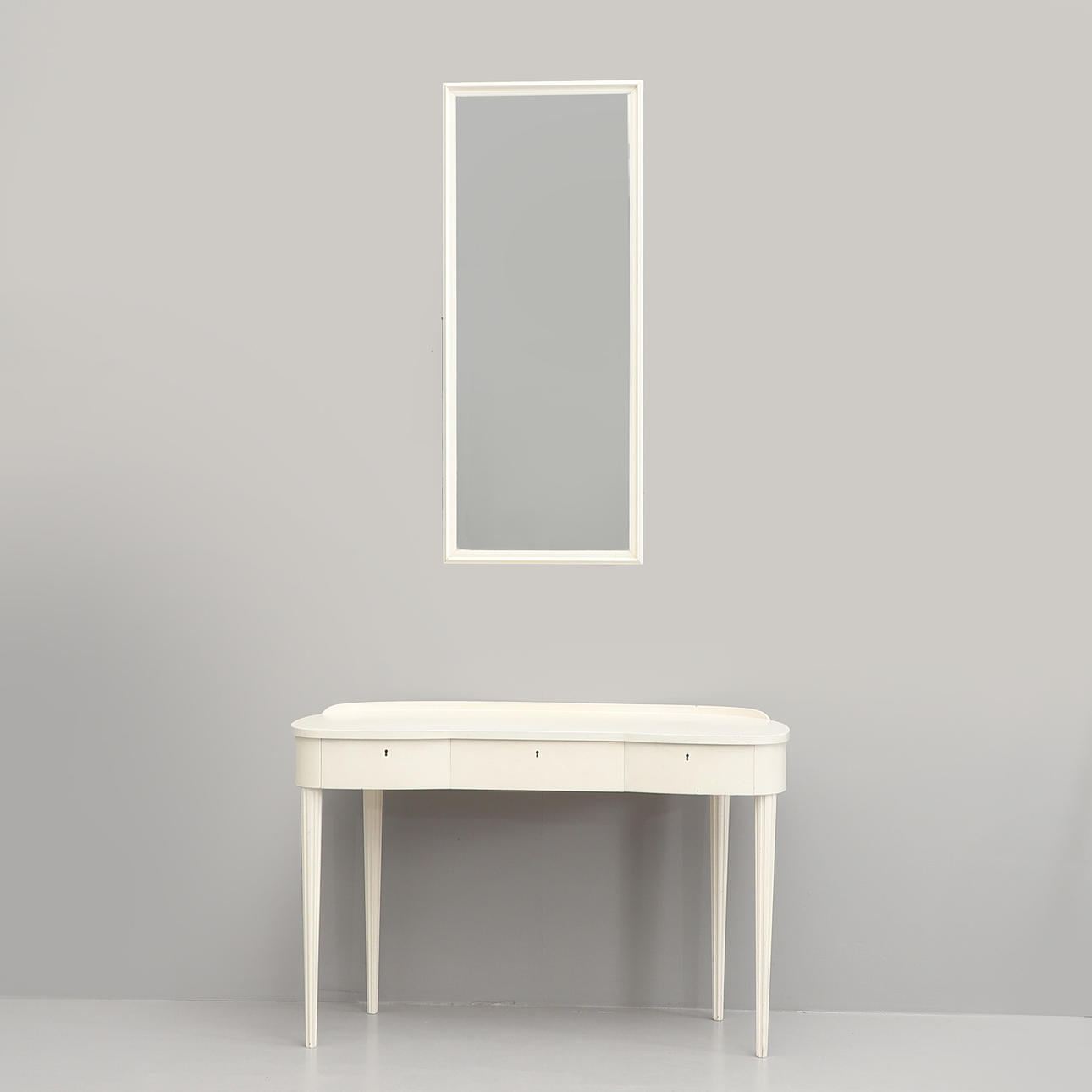 A mid 20th century dressing table and mirror.