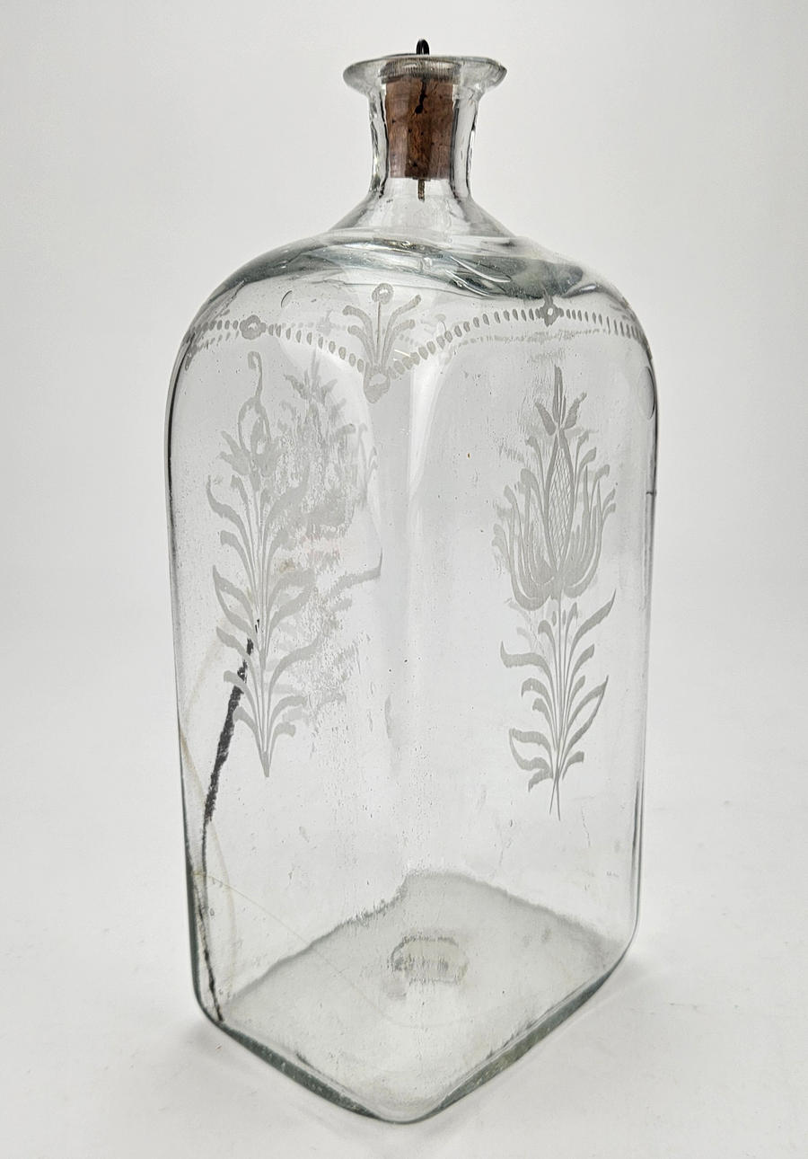 A 19th century glass bottle.