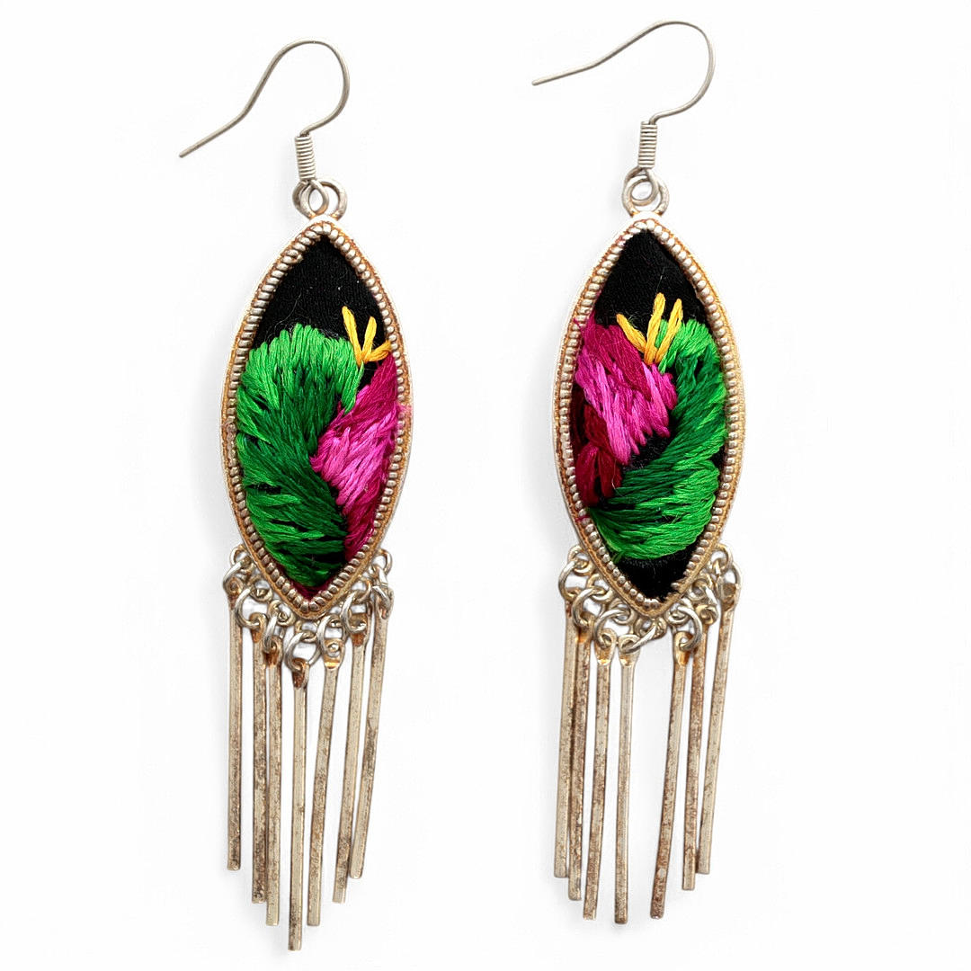 Embroidered long earrings.