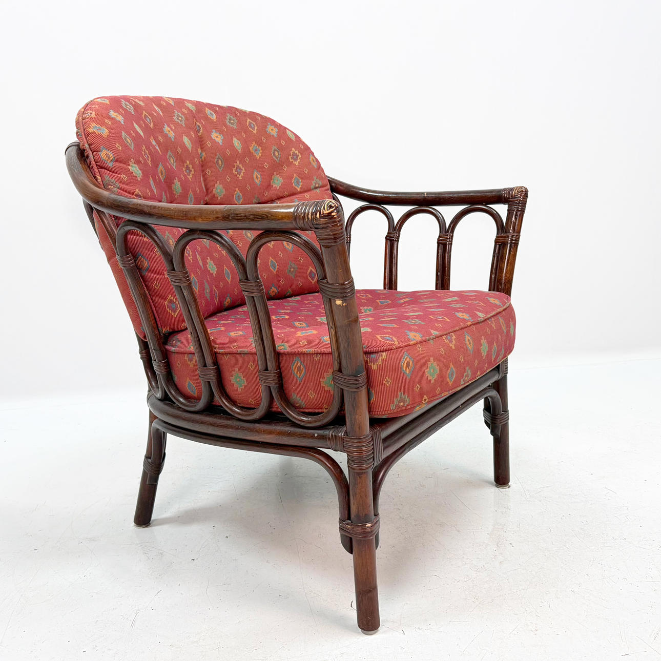 RATTAN ARMCHAIR - with cushions.