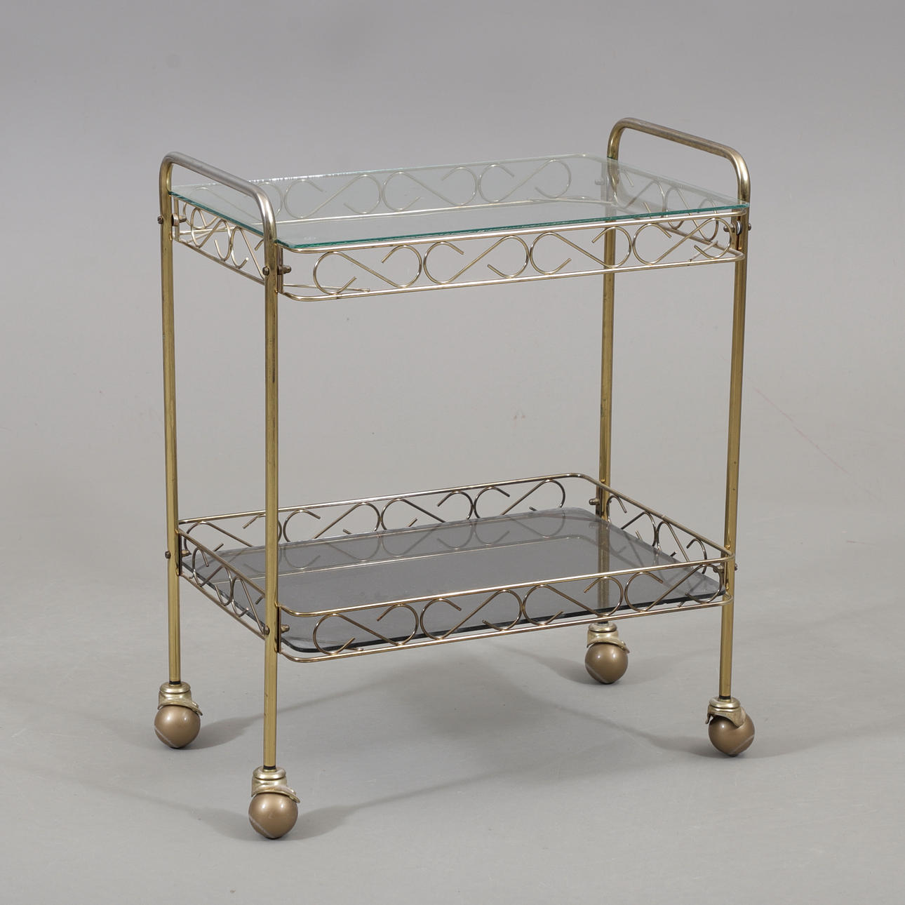 A glass/brass serving trolley, 1950s/1960s.
