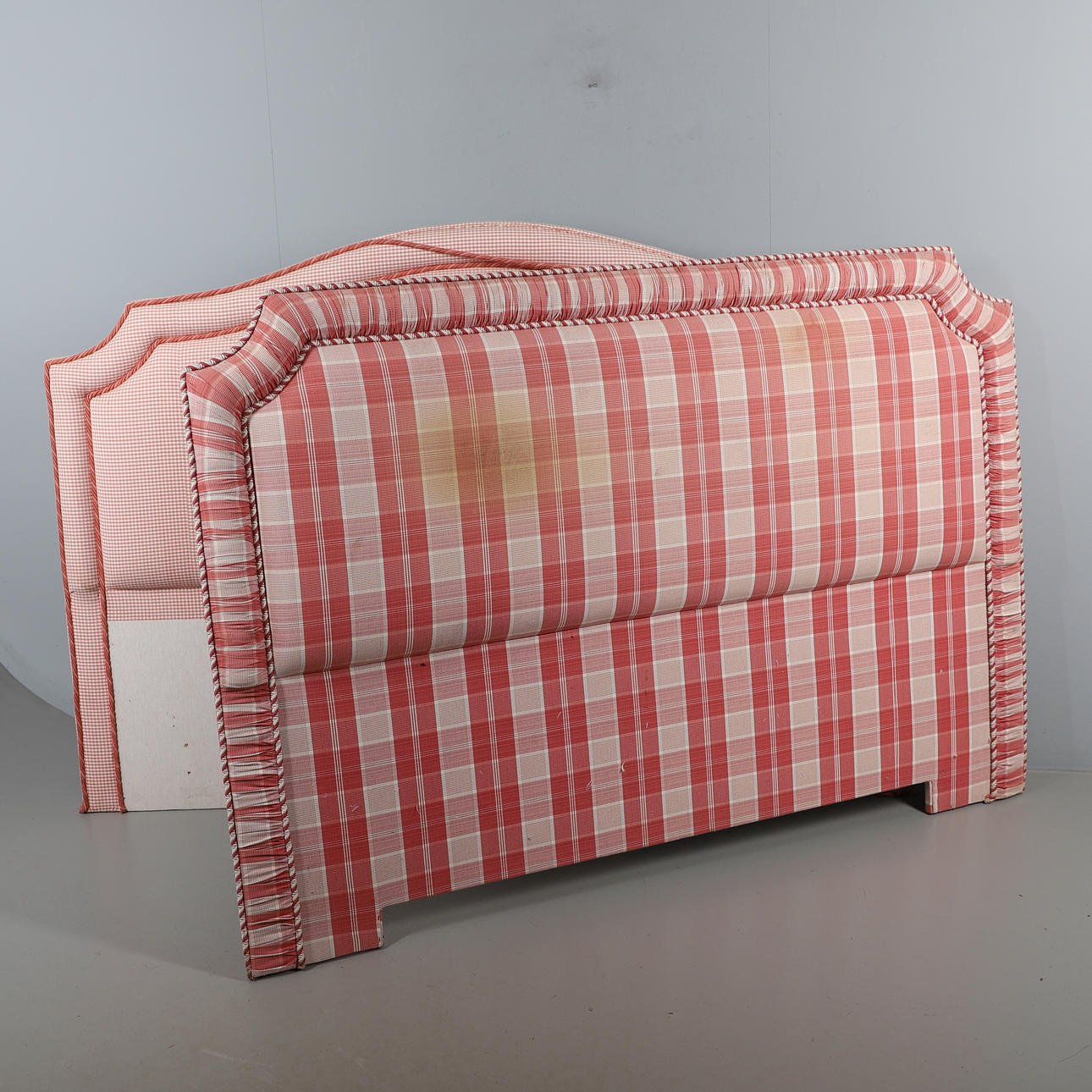 AN UPHOLSTERED BED FRAME.