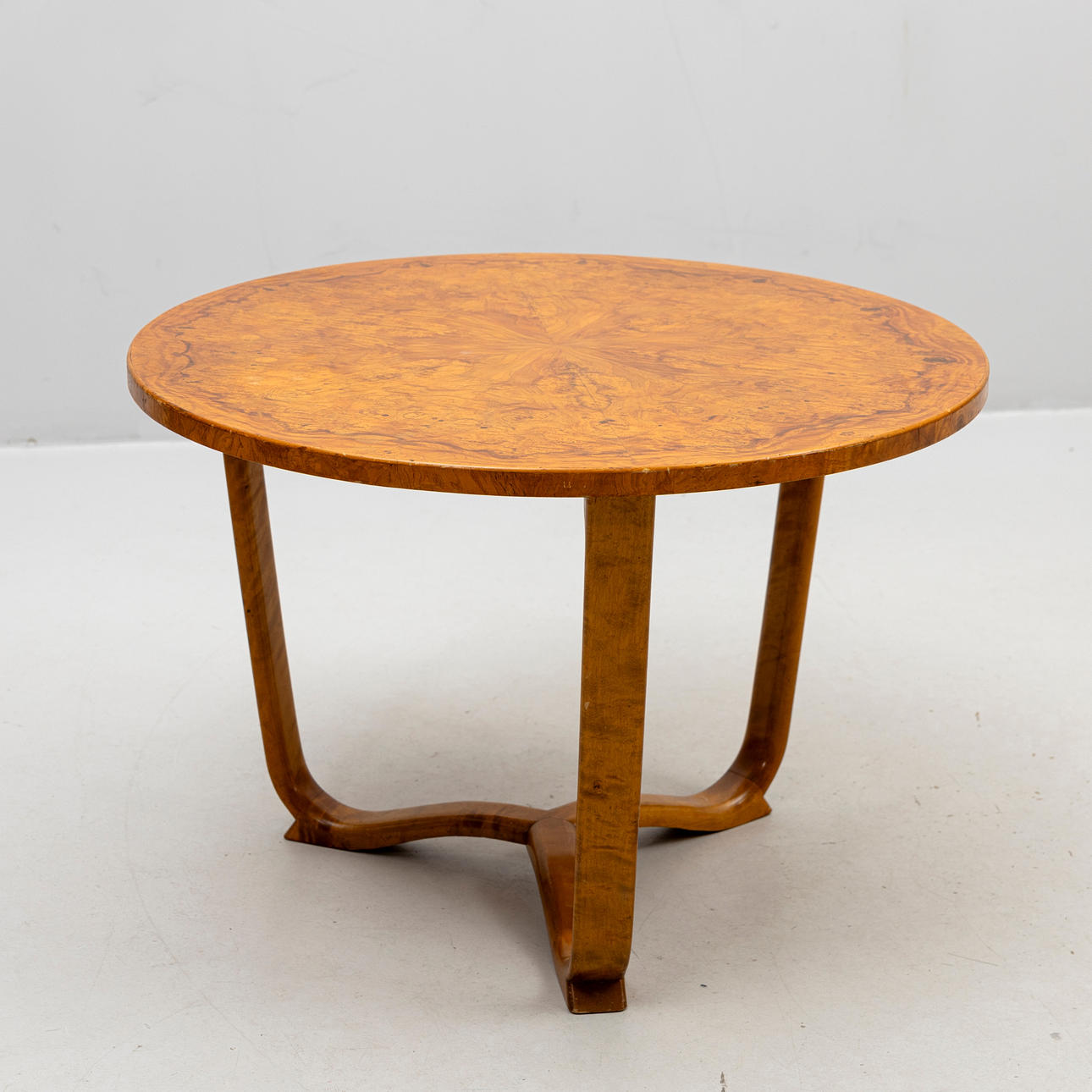 A 1940s root-veneered coffee table.