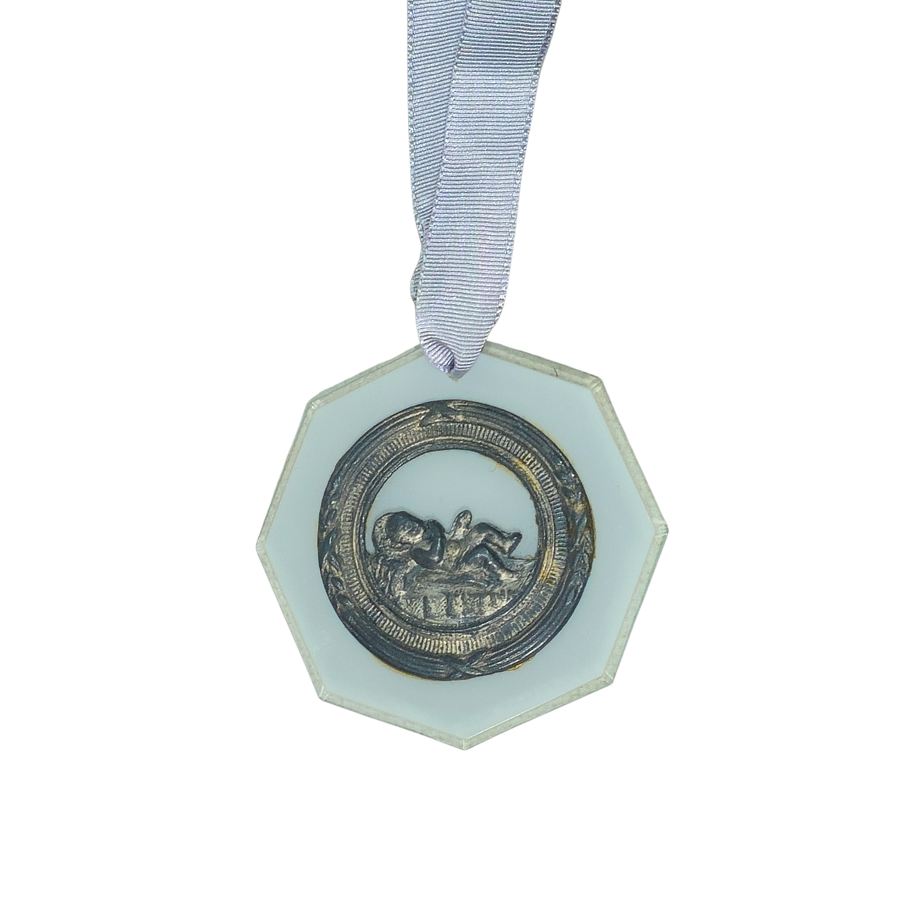 Antique metal birth medal.