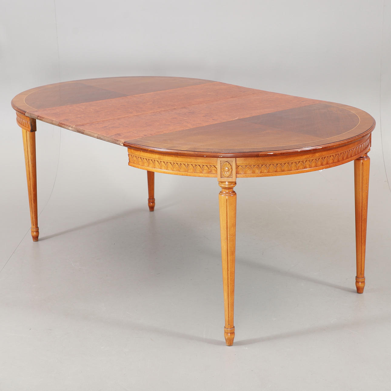 A Gustavian-style dining table, mid 20th century.