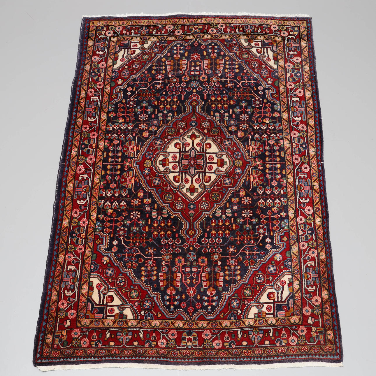 A carpet, hand-knotted, wool, Persian.