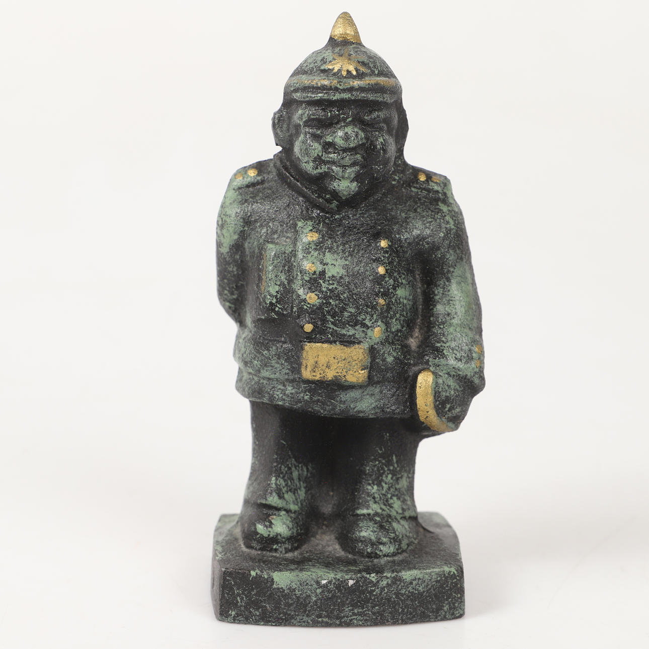 FIGURINE, Constable with flowers, cast iron, unsigned.