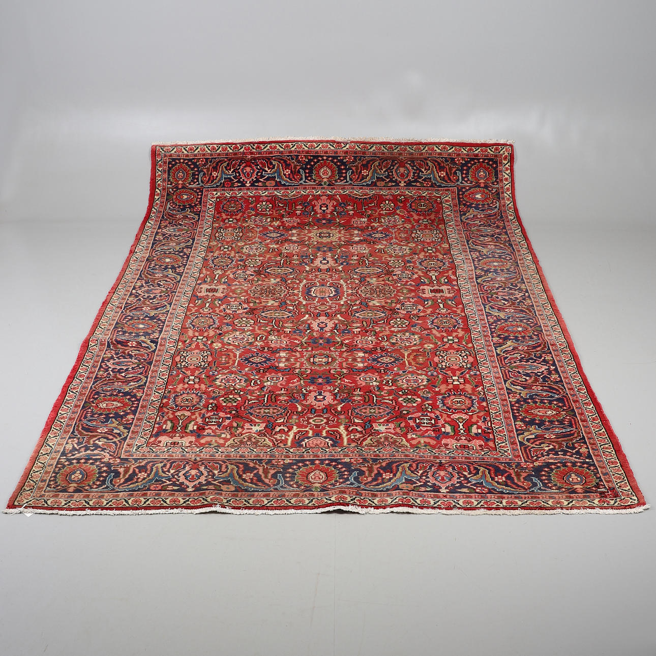 A WILTON TABRIZ DESIGN RUG.