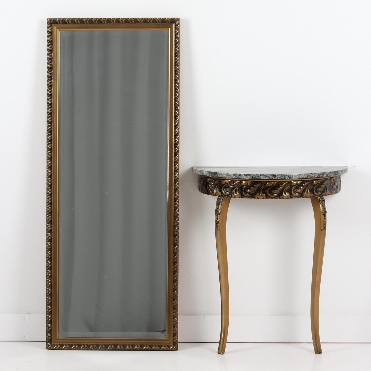 A mirror, with console table, bronzed, 20th century.