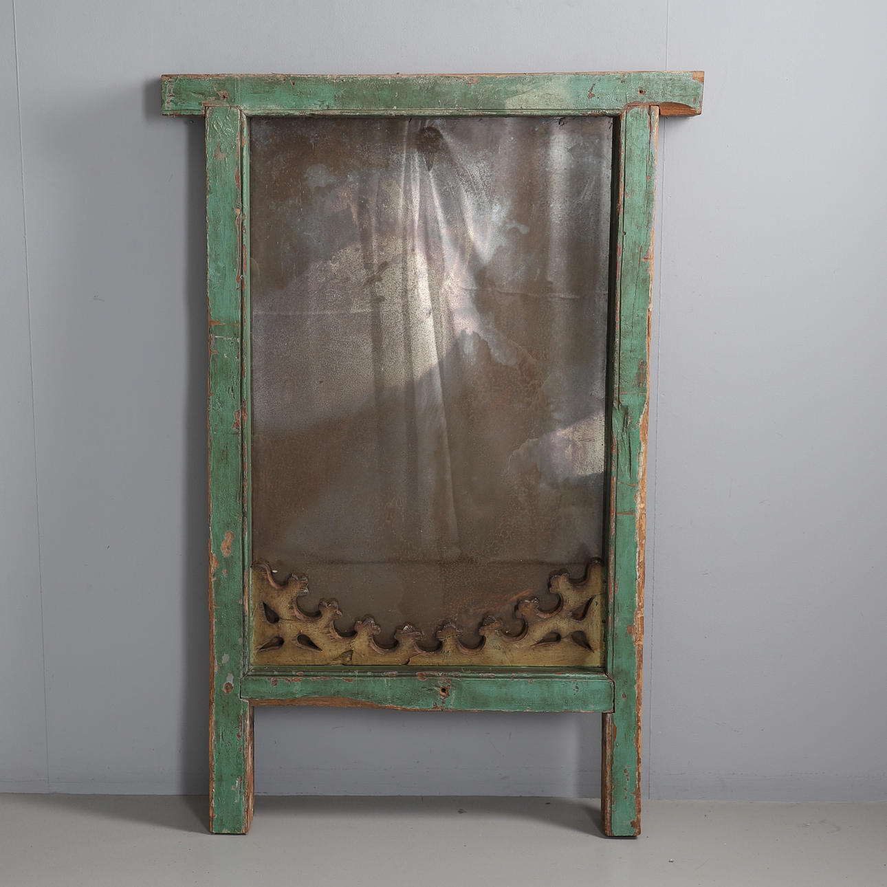 A PAINTED INDONESIAN DOOR FRAME MIRROR.