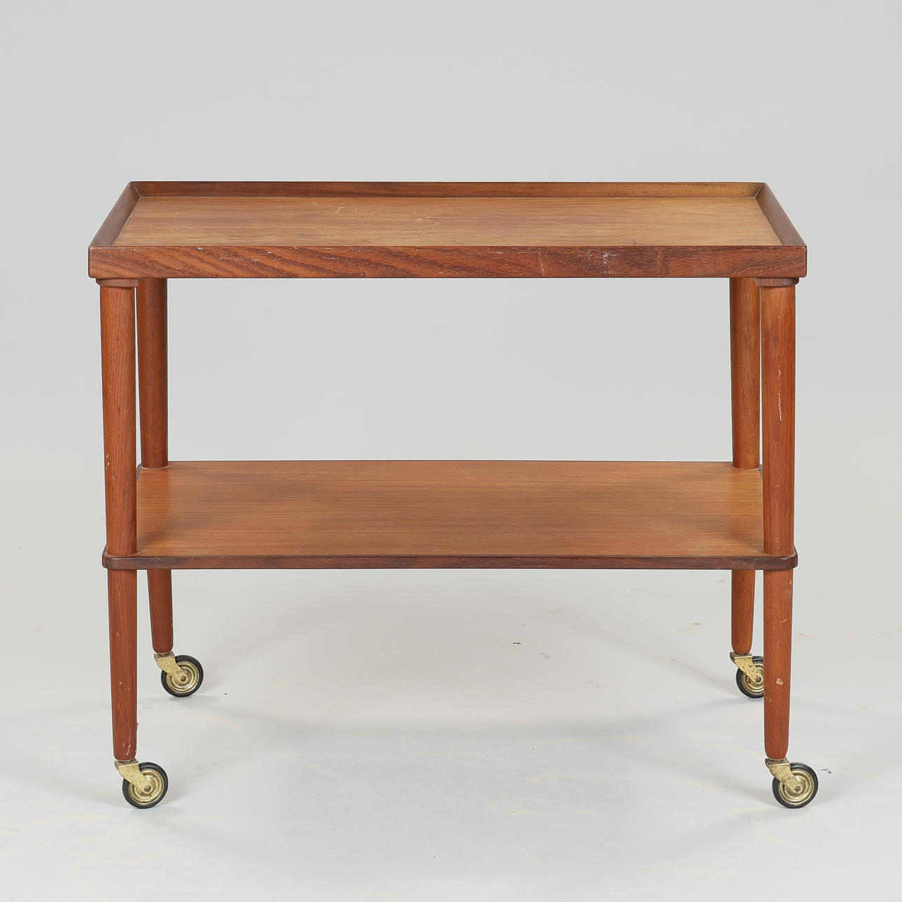 DANISH FURNITURE DESIGN. Teak roll table with underlying shelf, 1950s ...