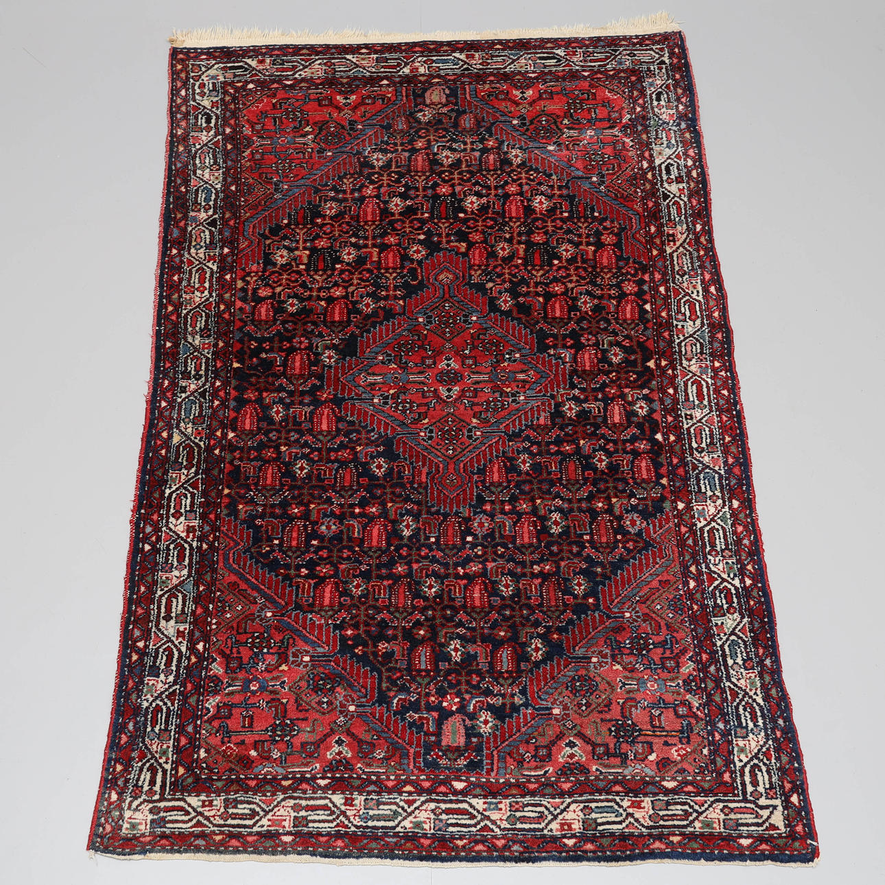 A hand-knotted carpet, wool, Persian.