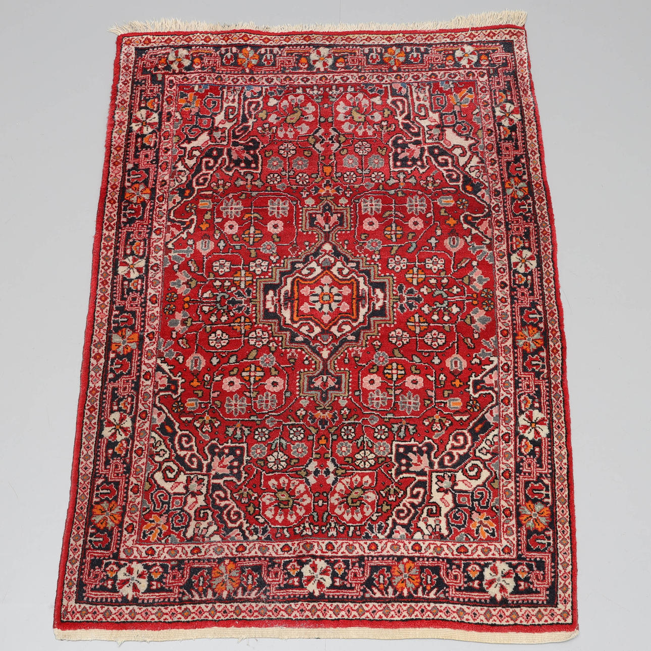 A carpet, handmade, wool, oriental.