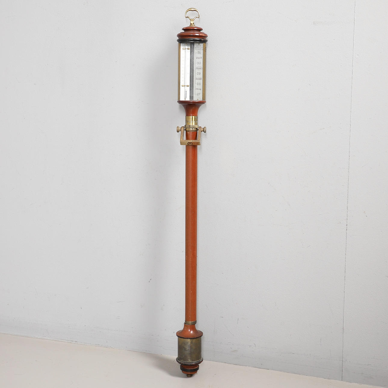 A MAHOGANY GIMBAL-MOUNTED SHIP’S BAROMETER.