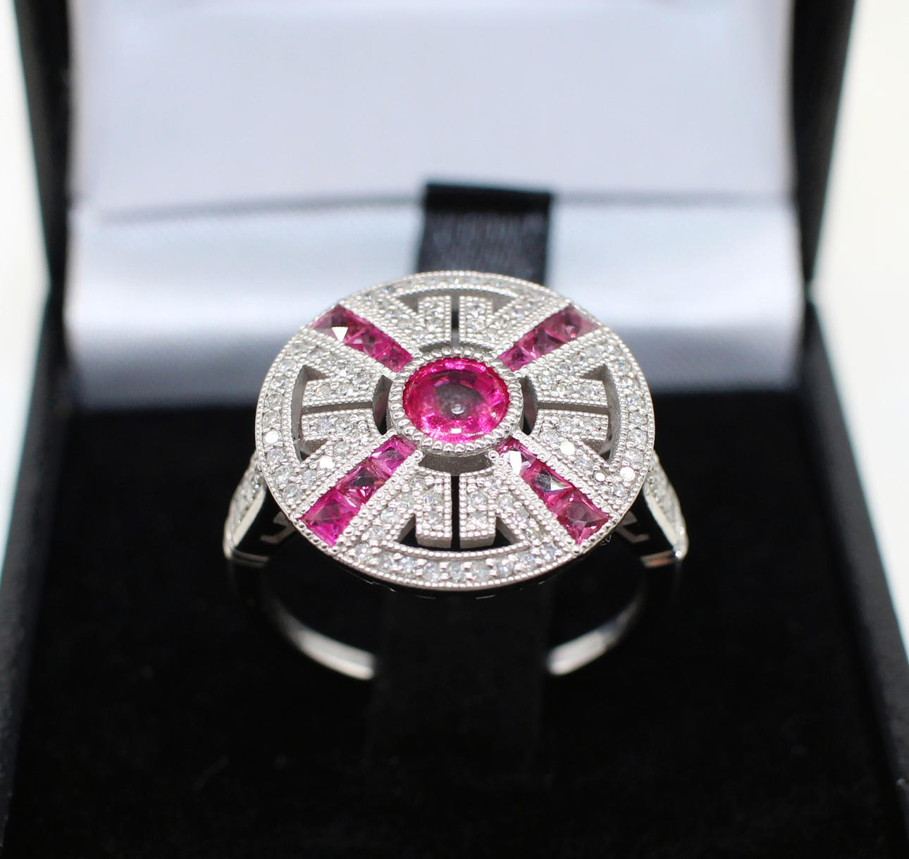 RUBY & DIAMOND TARGET RING IN PLATINUM.