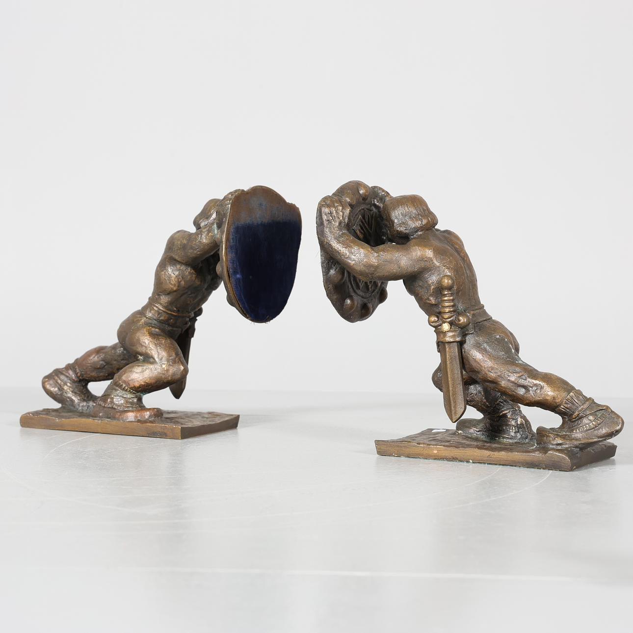 A pair of bookends, Metal, Signed.