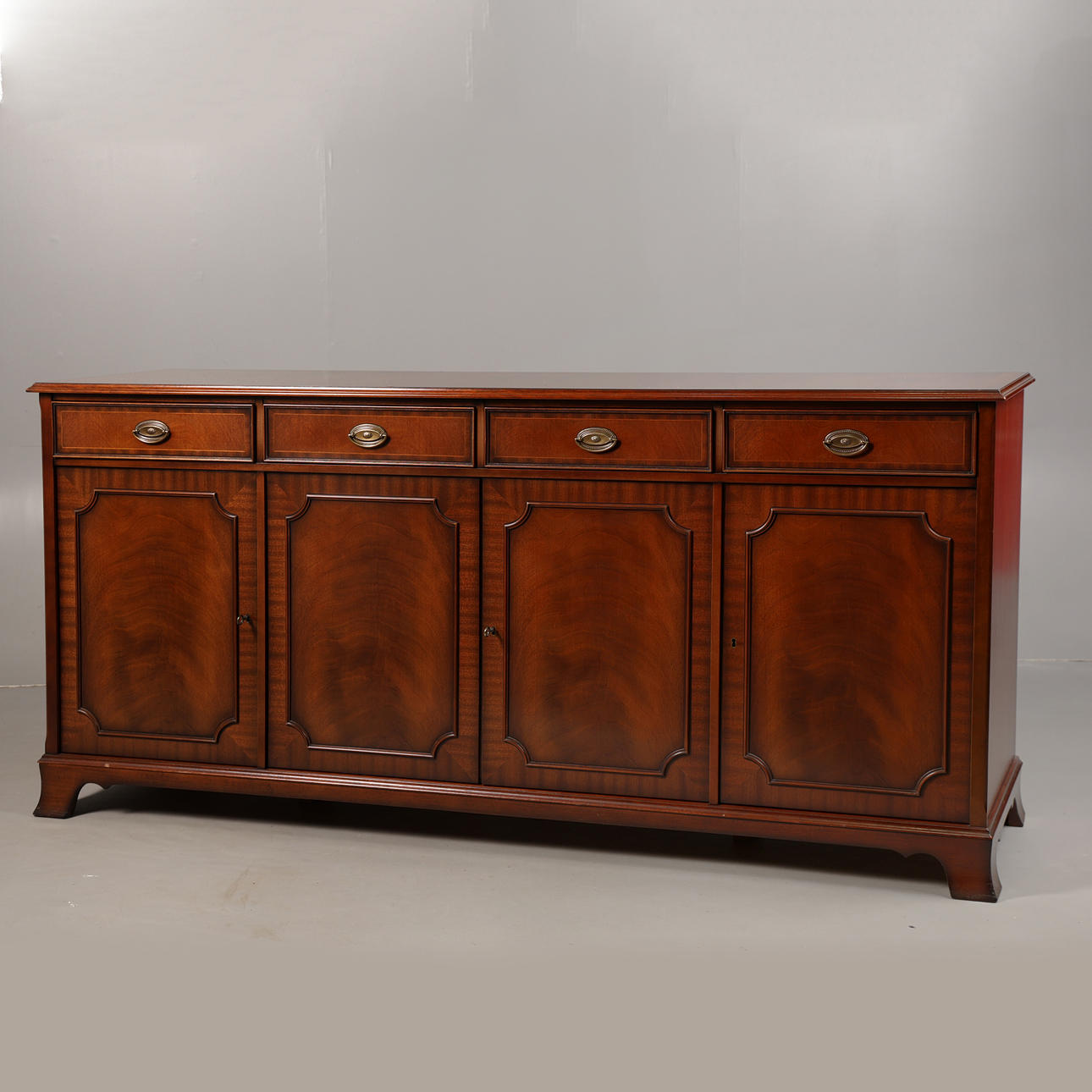 A REGENCY-STYLE MAHOGANY SIDEBOARD.