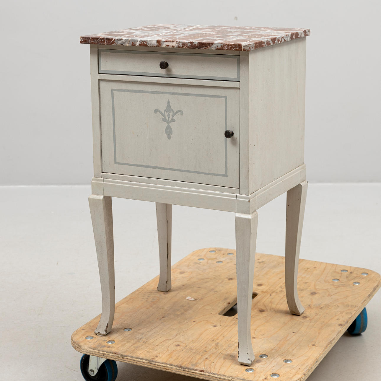 A bedside table, painted grey with stone top, with a tile mark, AB Svenska Möbelfabrikarna, Bodafors, 20th century.