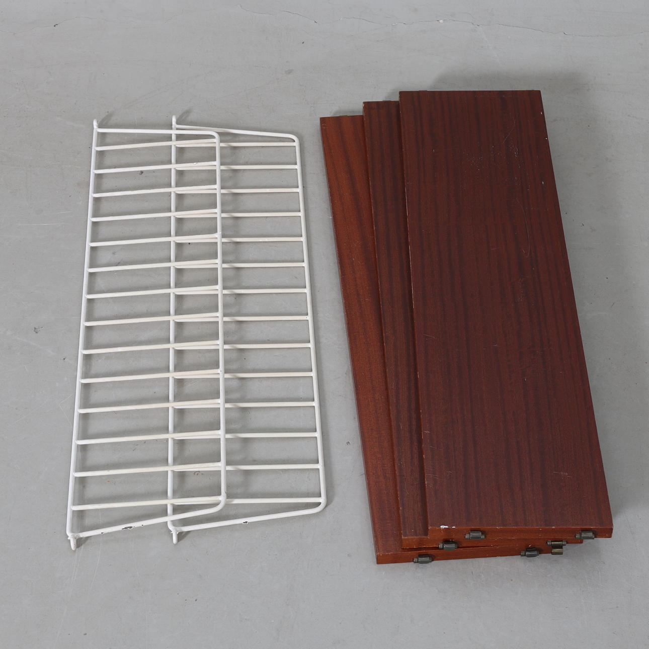 A 1960s teak veneer string shelf.