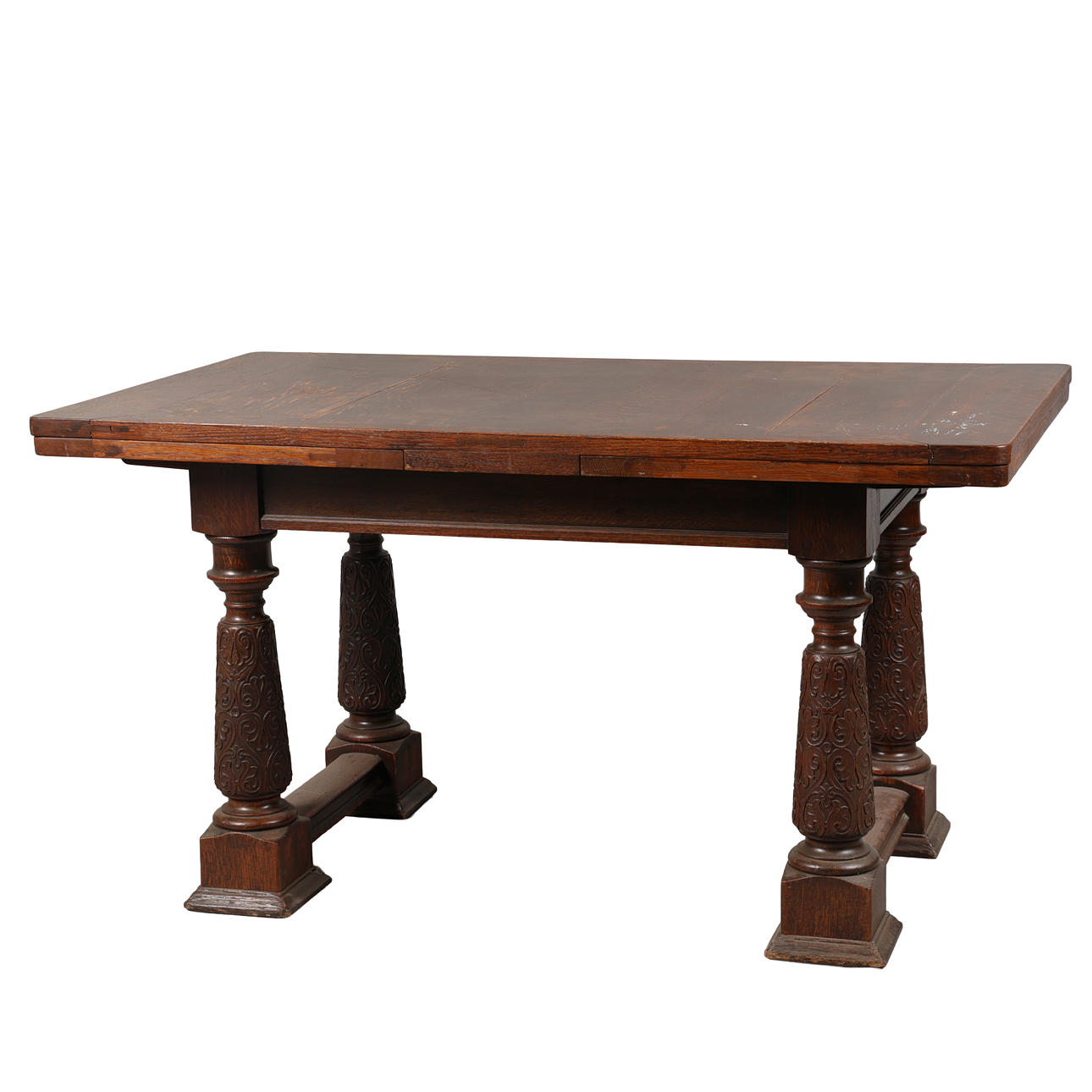 A 20TH CENTURY OAK DRAWER LEAF DINING TABLE.