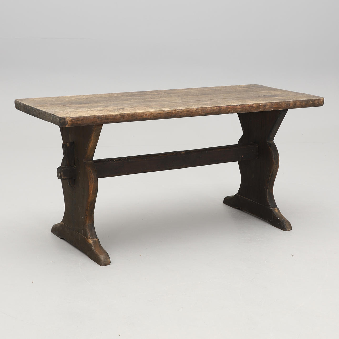 A 20th century oak and pine trestle table.