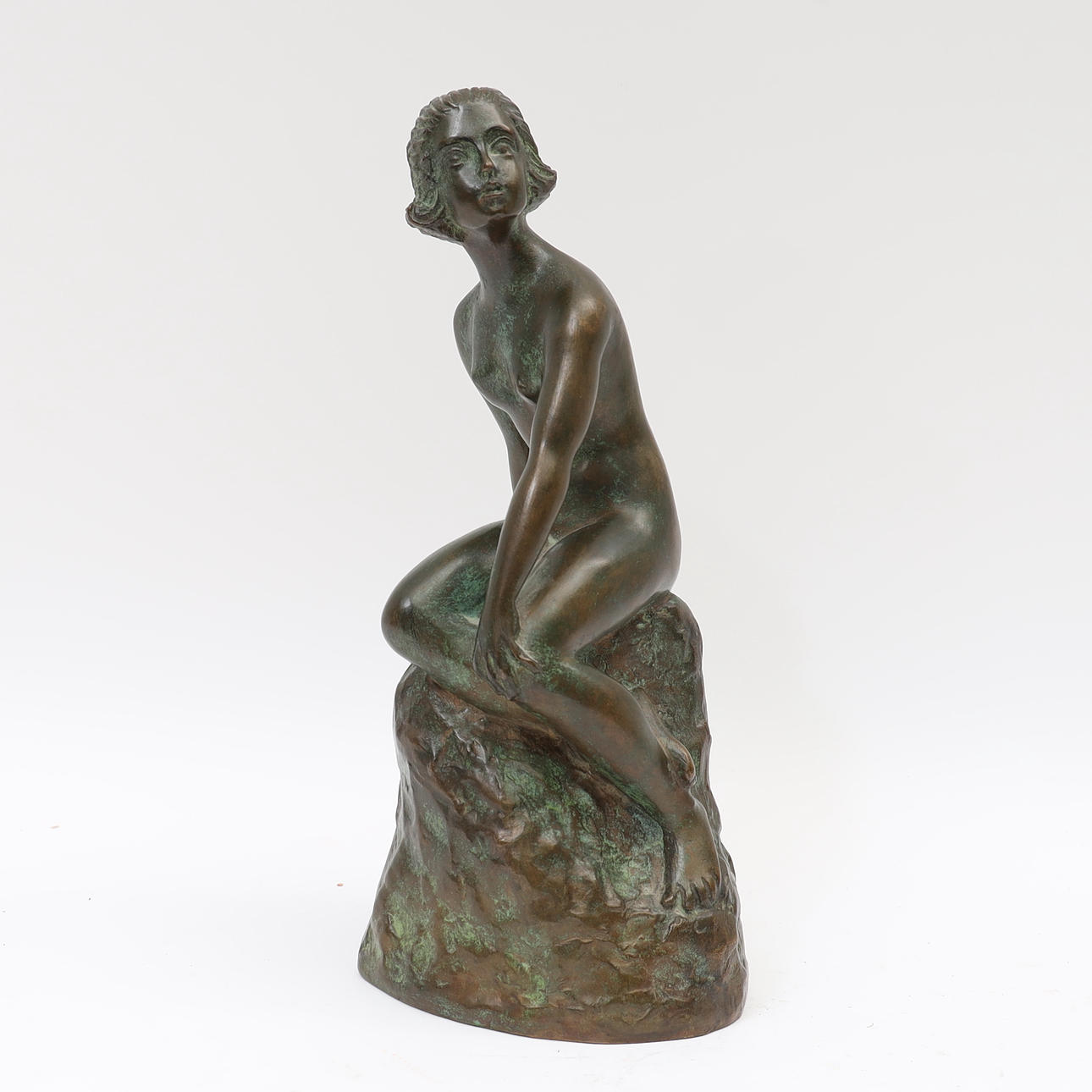 CARIN NILSSON. Sculpture, patinated bronze, woman on rock. Signed and ...