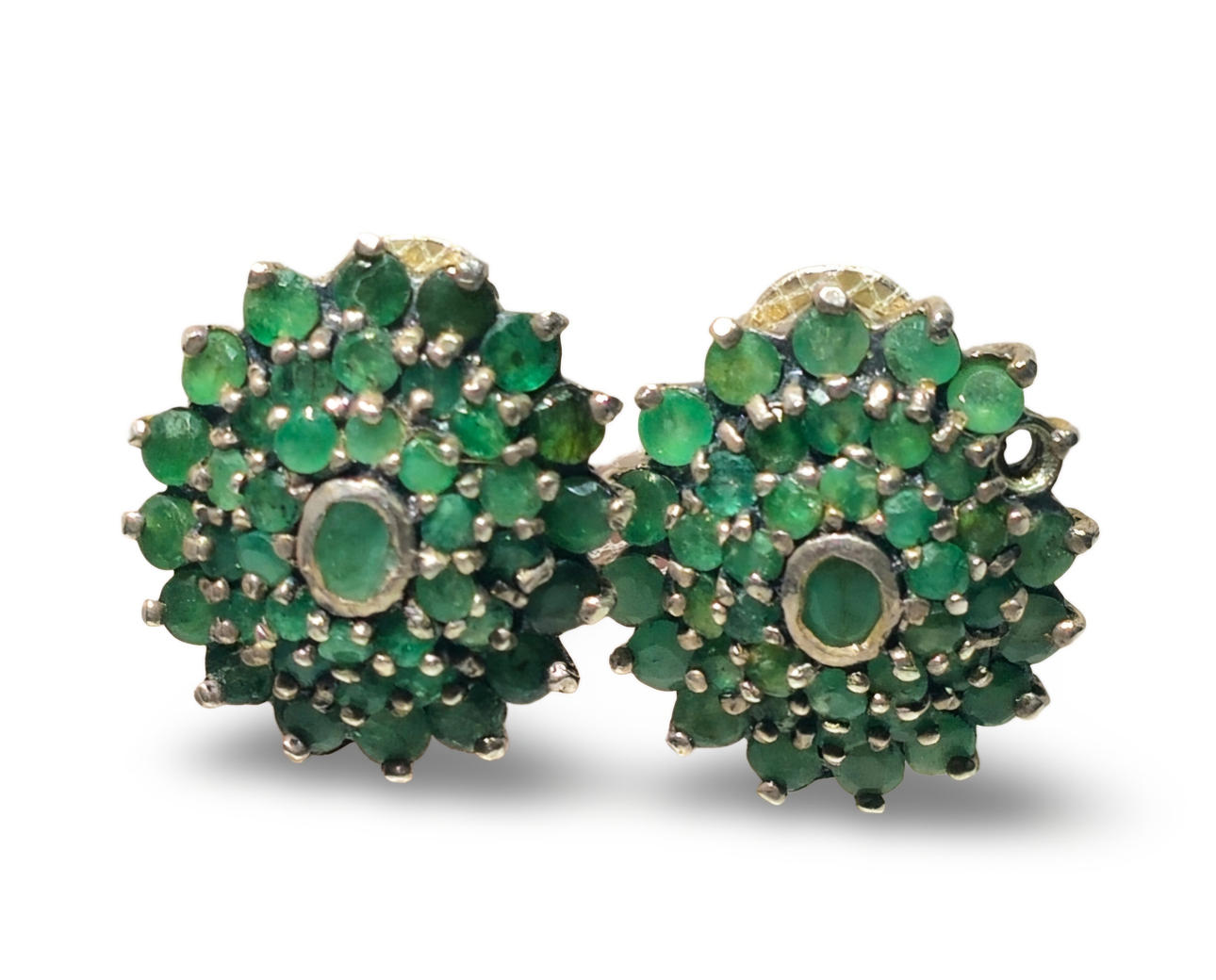 Emerald-fringed sterling silver earrings.