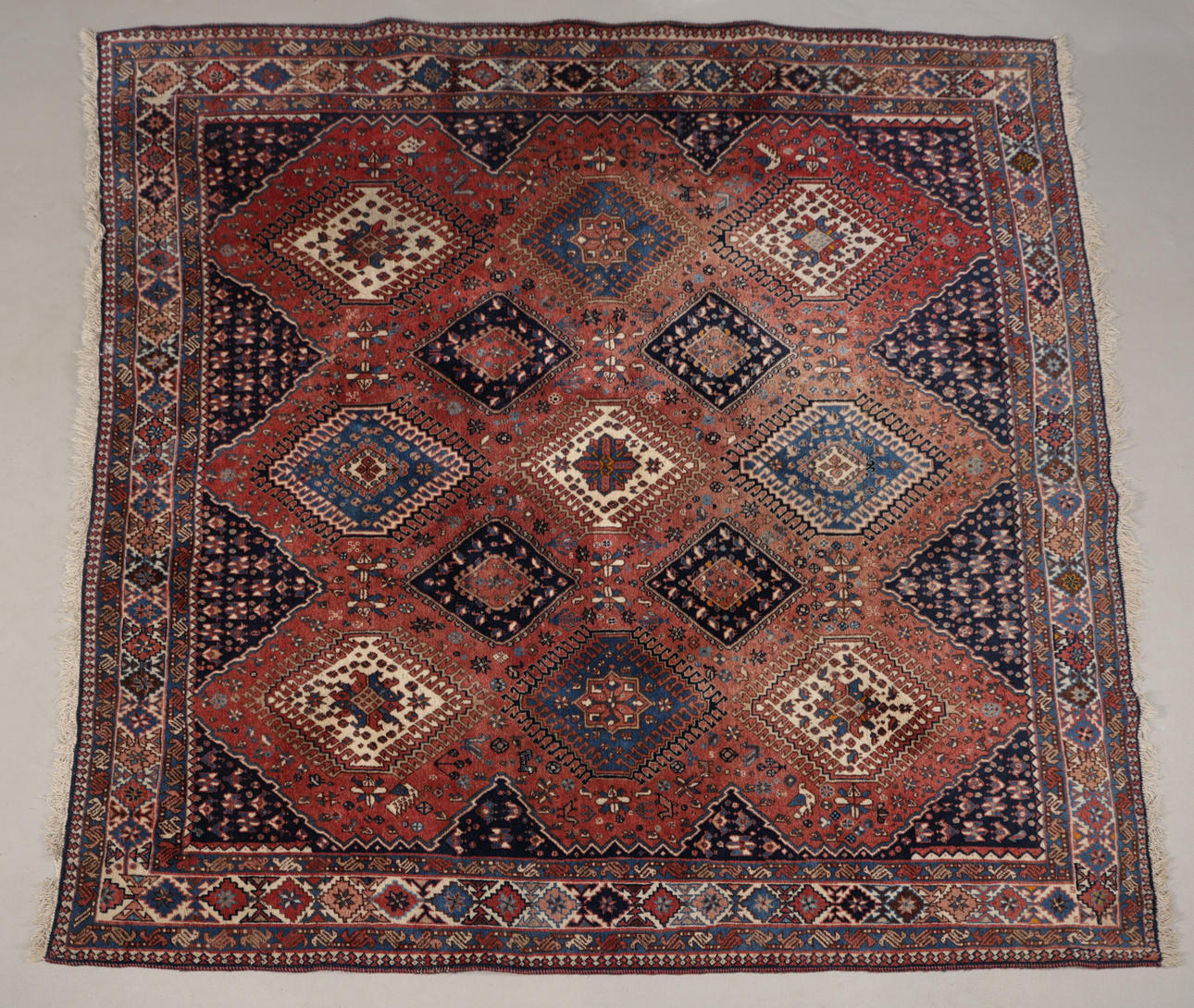A PERSIAN RUG.
