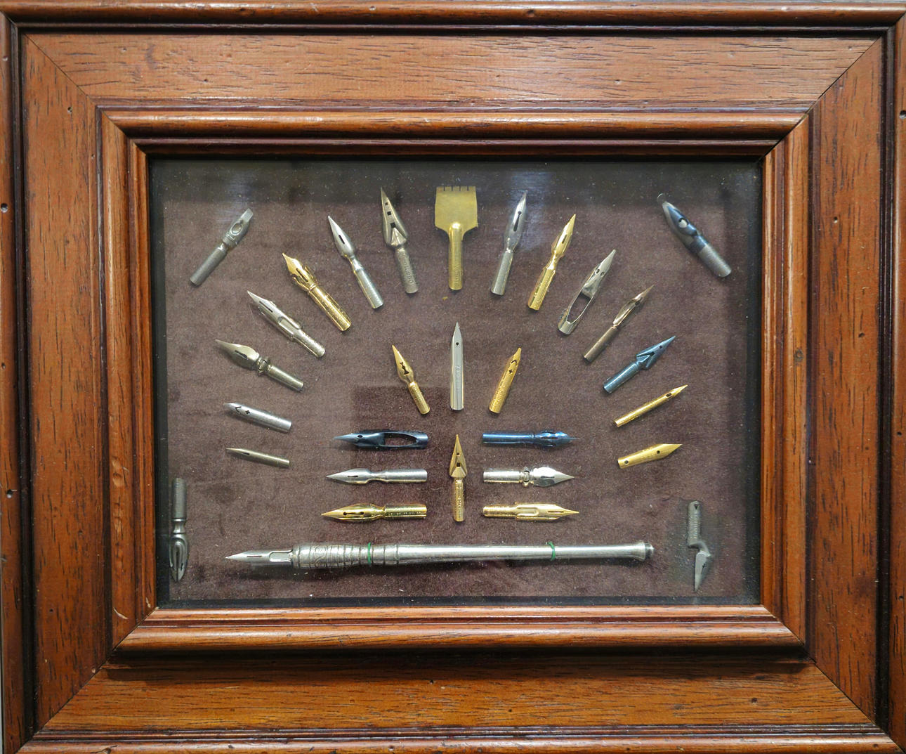 COLLECTION OF FRAMED PENS.