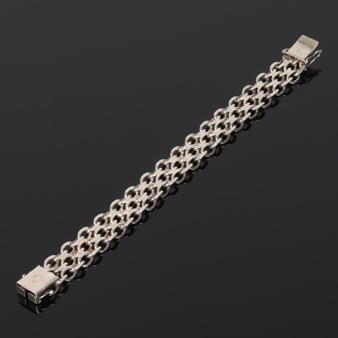 (6C29) A silver double “x-link” bracelet, 20th century.