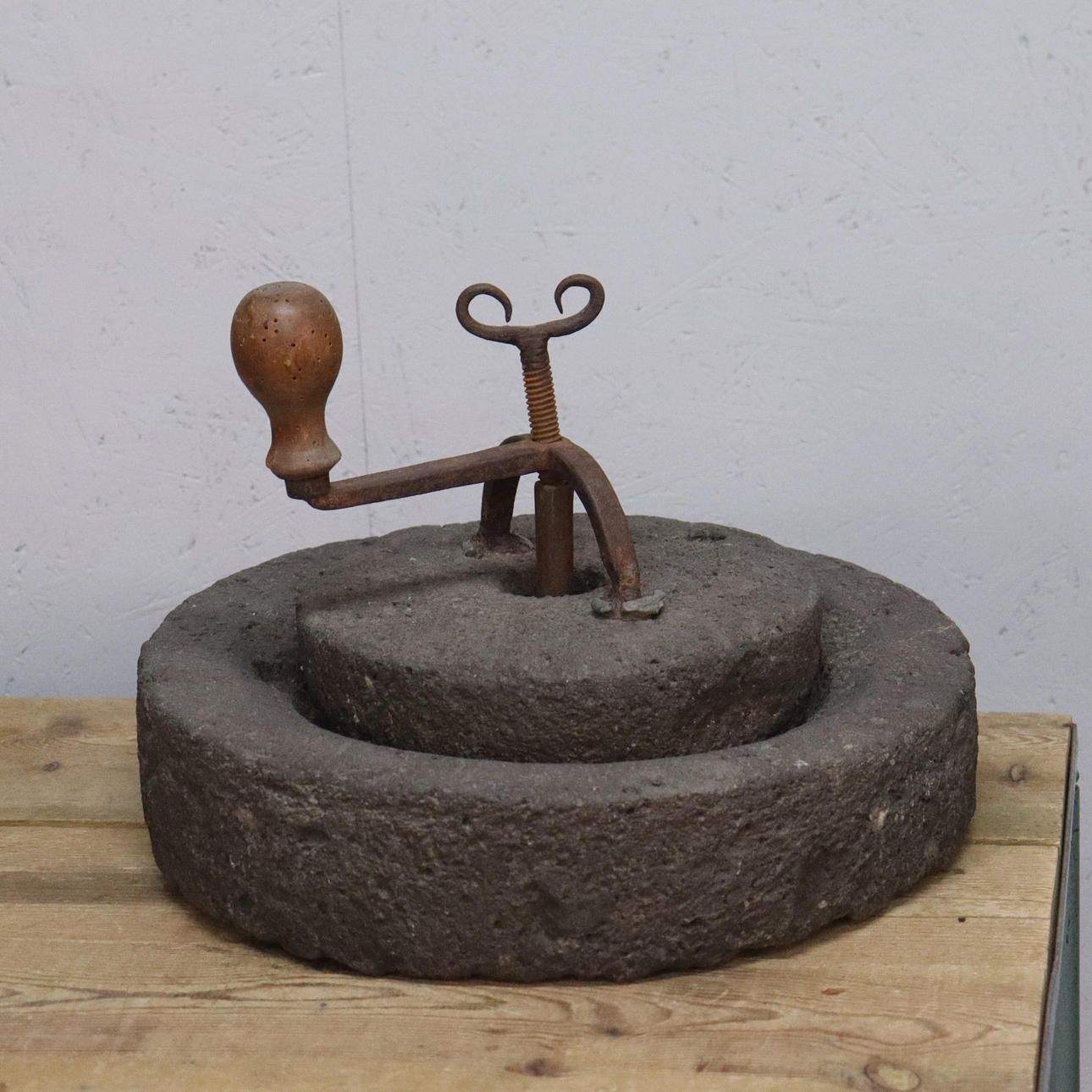 A hand mill, stone and forging, 19th century.