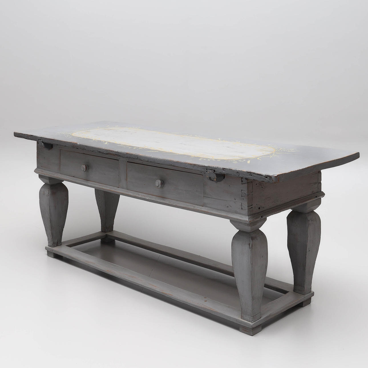 An 18th century table with drawers in sarg.