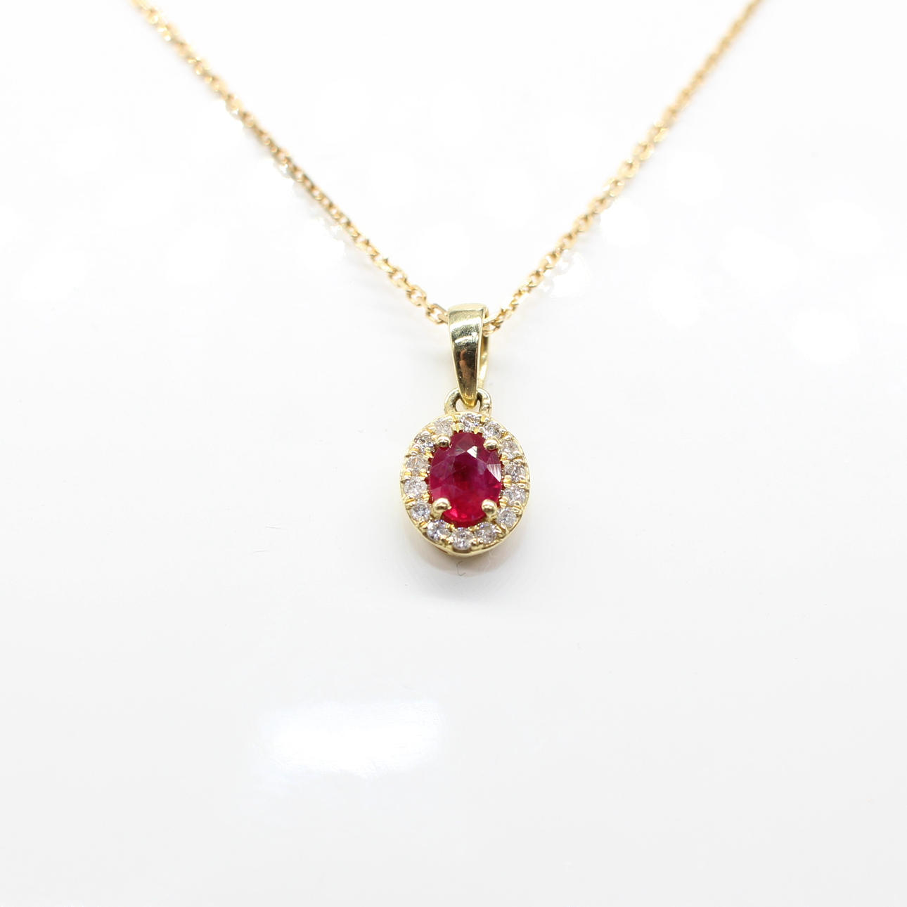 RUBY & DIAMOND CLUSTER NECKLACE.